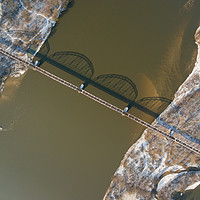 Buy canvas prints of Aerial view of the railway bridge over the river by Łukasz Szczepański