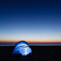 Buy canvas prints of Illuminated tent on the beach by the sea by Łukasz Szczepański