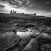 Buy canvas prints of Dunstanburgh at Dusk by Gary Clarricoates