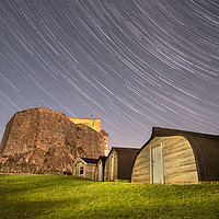 Buy canvas prints of Star Trails at Holy Island by Gary Clarricoates
