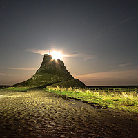 Buy canvas prints of Moon Rise at Holy Island by Gary Clarricoates