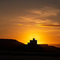 Buy canvas prints of Bamburgh Lighthouse Silhouette by Gary Clarricoates