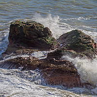 Buy canvas prints of A Heavy Sea smashes the exposed rocks by Brian Sandison