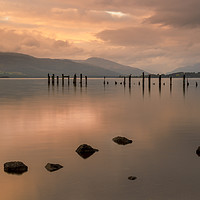 Buy canvas prints of Loch Lomond jetty and mountains at sunset by Alan Hill