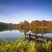 Buy canvas prints of Still waters of a lake in autumn by Alan Hill