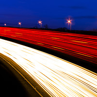 Buy canvas prints of Light trails caused by multiple car headlights and tail lights by Alan Hill