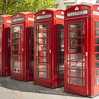 Buy canvas prints of Four red telephone boxes in London by Alan Hill