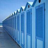 Buy canvas prints of Blue Beach Huts in Italy by Carla Lock