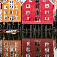 Buy canvas prints of Waterfront buildings and reflections, Trondheim, Norway by Dave Collins