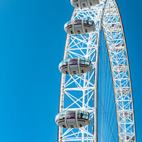Buy canvas prints of Capsules on the London Eye against a blue sky by Dave Collins