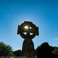 Buy canvas prints of Celtic Cross with sun star burst through the upper left hand quadrant by Dave Collins