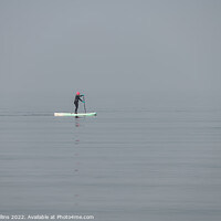 Buy canvas prints of A woman on a paddle board in still waters in the mist of the Firth of Forth, Edinburgh, Scotland by Dave Collins