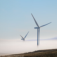 Buy canvas prints of Wind Turbines in the mist in the hills of Northumberland, England by Dave Collins