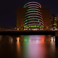Buy canvas prints of The lights of the Dublin Convention Centre reflected in the river Liffey at night by Dave Collins