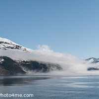 Buy canvas prints of Fog on the mountains and sea in Passage Canal, Whittier, Alaska USA by Dave Collins