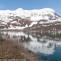 Buy canvas prints of The end of the Passage Canal inlet with mountains behind at Whittier, Alaska, USA by Dave Collins