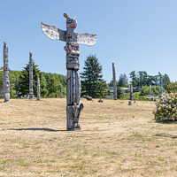 Buy canvas prints of Ceremonial Totem Poles in the Namgis Burial Grounds in Alert Bay, British Columbia, Canada by Dave Collins