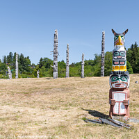 Buy canvas prints of Ceremonial Totem Poles in the Namgis Burial Grounds in Alert Bay, British Columbia, Canada by Dave Collins