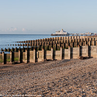 Buy canvas prints of Eastbourne Pier and Beach with a clear blue sky and calm seas, Eastbourne, England by Dave Collins