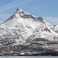 Buy canvas prints of Large tanker, Alaskan Explorer,  docked at the Valdez Marine Terminal in Port Valdez with snow covered mountains behind, Valdez, Alaska, USA by Dave Collins