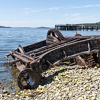 Buy canvas prints of Abandoned Machinery  on the beach of Alert Bay with an old disused pier behind behind, British Columbia, Canada by Dave Collins