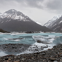 Buy canvas prints of Ice sheets on Valdez Glacier Lake with distance mountains in rain and mist, Valdez, Alaska, USA by Dave Collins