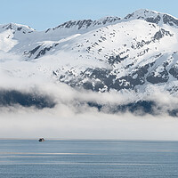 Buy canvas prints of Boat approaching fog on the mountains and sea in Passage Canal, Whittier, Alaska USA by Dave Collins