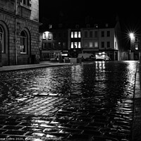 Buy canvas prints of Rain soaked cobbled street at night, Kelso, Scotla by Dave Collins
