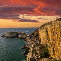 Buy canvas prints of BloodRed Sunset at South Stack Lighthouse by Colin Allen