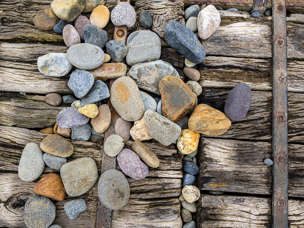 Newgale - Pebbles on the Boardwalk. Picture Board by Colin Allen