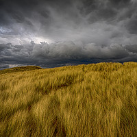 Buy canvas prints of Storm Clouds over the Sand Dunes at Aberffraw by Colin Allen