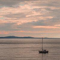 Buy canvas prints of Sailboat moored off the coast at Aberffraw. by Colin Allen