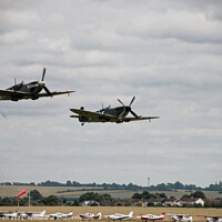 Buy canvas prints of Spitfire and Hurricane flying in low level formation by Ryan Smith