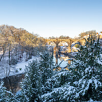 Buy canvas prints of Winter snow sunrise over the river Nidd in Knaresborough, North Yorkshire. Panoramic format. by mike morley