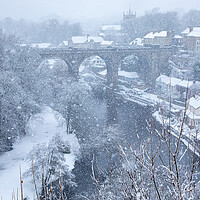 Buy canvas prints of Winter snow over the river Nidd and famous landmark railway viaduct in Knaresborough, North Yorkshire. by mike morley