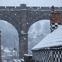 Buy canvas prints of Winter snow over the river Nidd and famous landmark railway viaduct in Knaresborough, North Yorkshire. by mike morley
