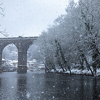 Buy canvas prints of Winter snow over the river Nidd and famous landmark railway viaduct in Knaresborough, North Yorkshire by mike morley