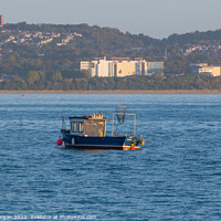 Buy canvas prints of Small fishing boat on Swansea bay by Bryn Morgan