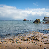 Buy canvas prints of A rocky beach next to a body of water by Bryn Morgan