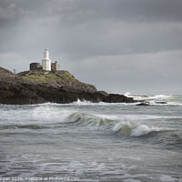 Buy canvas prints of Wave at Mumbles lighthouse by Bryn Morgan