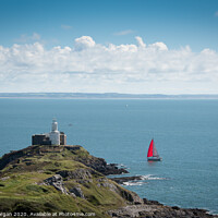 Buy canvas prints of Yacht passing Mumbles lighthouse by Bryn Morgan