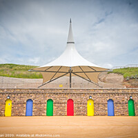 Buy canvas prints of Barry island colourful doors and massive parasol by Bryn Morgan