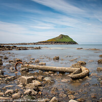 Buy canvas prints of The Worms head, Rhossili, with the anchor of the Samuel by Bryn Morgan