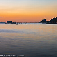 Buy canvas prints of Mumbles lighthouse and pier at sunrise by Bryn Morgan