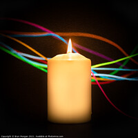 Buy canvas prints of Burning candle with streaks of coloured light by Bryn Morgan
