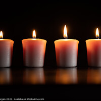 Buy canvas prints of Four burning candles by Bryn Morgan