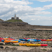 Buy canvas prints of Mumbles lighthouse with Kayaks in foreground at the Bracelet bay by Bryn Morgan