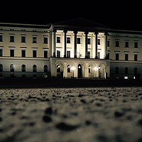 Buy canvas prints of Oslo Palace on a cold, winter evening. by Mike Evans