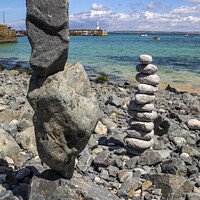 Buy canvas prints of Rock Balancing at St. Ives in Cornwall, UK by Chris Dorney