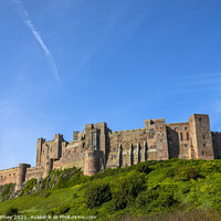 Buy canvas prints of Bamburgh Castle in Northumberland, UK by Chris Dorney